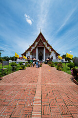 Obraz premium Phra Nakhon Si Ayutthaya District, Wat Phra Mongkhon Bophit, Thailand, July 07, 2024, Colossal Reclining Buddha.