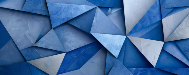 Fototapeta premium A vibrant cobalt blue background featuring intricate geometric shapes in varying shades of blue and silver, with subtle highlights and shadows adding depth and dimension.