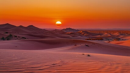 Fototapeta premium Sunset over the sand dunes in the desert background