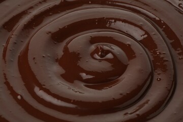 Tasty melted chocolate as background, closeup view