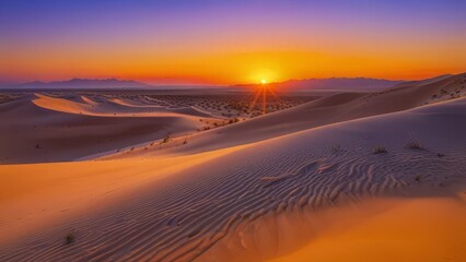 Sunset over the sand dunes in the desert background