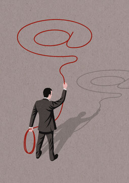 Businessman throwing at symbol shaped lasso