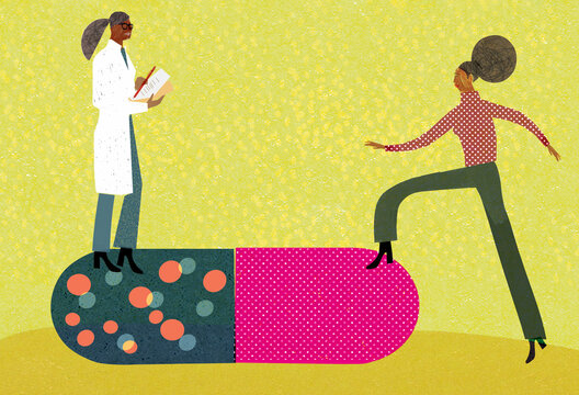 Doctor prescribing large pill for patient