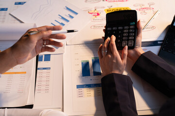 Businessman and woman discussing commercial real estate sector faces risks as financial buy used...