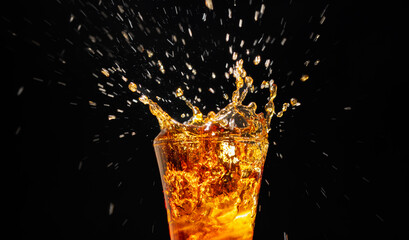 Close-up of soft drinks A glass of delicious refreshing summer water with ice cubes isolated on black background