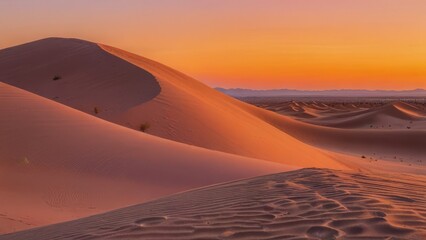 Sunset over the sand dunes in the desert background