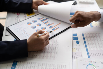 Businessman and woman discussing commercial real estate sector faces risks as financial buy used...