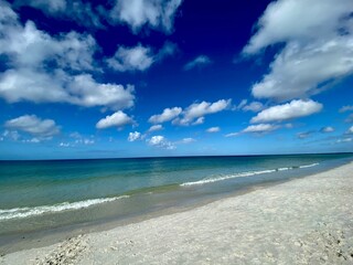 Wide angle beach scene with clouds