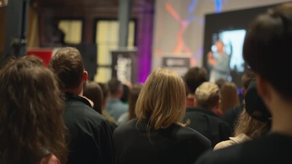 In conference space, groups of innovative young adults collaborate, they share visions and strategies about startups, while mentors from business incubators guide their ideas towards success