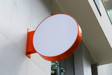 Rounded Street storefront shop, cafe, restaurant mounted signboard mock up design template. Blank white store sign design mockup.