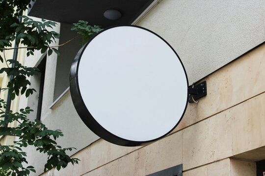 Rounded Street storefront shop, cafe, restaurant mounted signboard mock up design template. Blank white store sign design mockup.