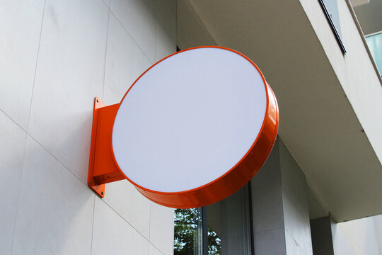 Rounded Street storefront shop, cafe, restaurant mounted signboard mock up design template. Blank white store sign design mockup.