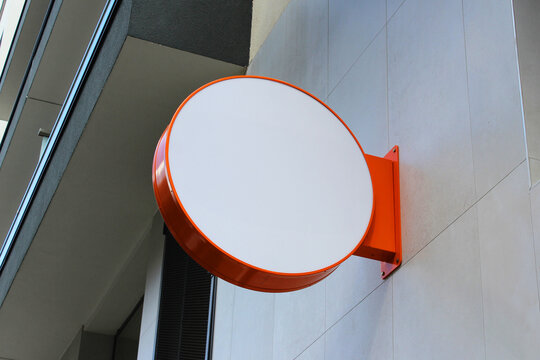 Rounded Street storefront shop, cafe, restaurant mounted signboard mock up design template. Blank white store sign design mockup.