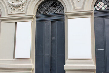 Large white billboard banner on an office or storefront mockup. Blank white office or shop sign mock up template.