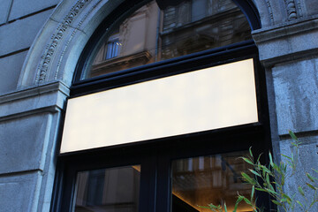 Fototapeta premium Blank white restaurant or shop sign mockup, large billboard banner on a storefront template.