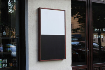 Large white billboard banner on an office or storefront mockup. Blank white office or shop sign mock up template.