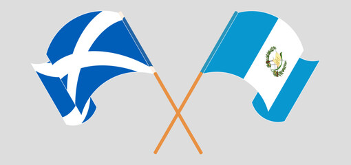 Crossed and waving flags of Scotland and Republic of Guatemala