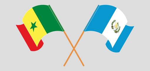 Crossed and waving flags of Senegal and Republic of Guatemala