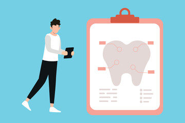 The boy is looking at the dental report.