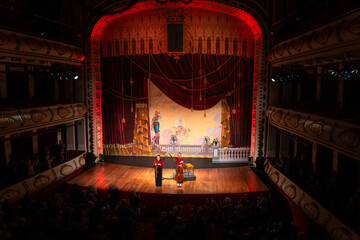 Historic theater hosting an elegant stage performance. Classical music concept.