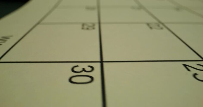 An empty table for the schedule with days of the week and numbers. Close-up