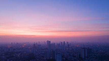 Fototapeta premium A stunning urban skyline captured during a serene sunrise, showcasing vibrant colors and tranquil atmosphere. Perfect for travel themes.