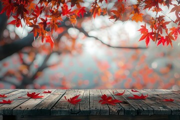 Empty wood table top and blurred autumn tree and red leaf background for display your products