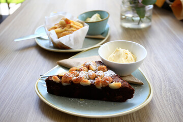 close up of muffin on wooden table.