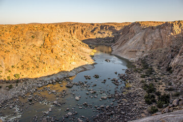 The majestic Orange River ravine, in the golden late afternoon light. Photographed in the Augrabies Falls National Park in South Africa.