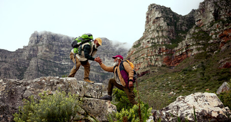 Mountain, hiking and senior men with helping hand for support, physical activity or climbing...