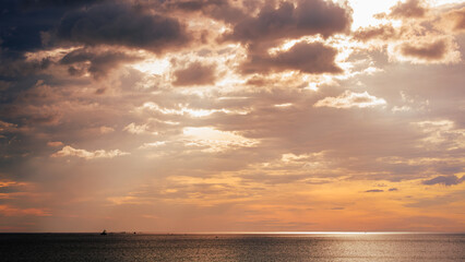 A Landscape of on the sea with red clouds and red sky at sunrise like a oil painting