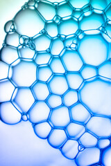 Fototapeta premium Abstract background bio technology, macro photography foam and water with gradient background. Molecule multicolor backgorund