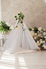 decoration wigwam with flowers in the room © Владимир Паляница