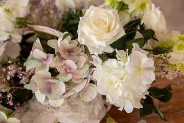a bouquet of different flowers on the table