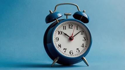 Classic Alarm Clock on Blue Background