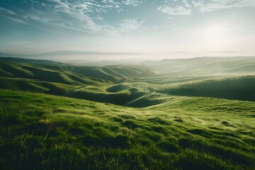 Fototapeta premium Serene landscape of rolling green hills under a tranquil sky.