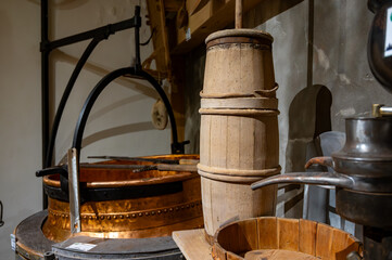 Old equipment for cheese production, wheels, rounds of Comte cheese made from raw cow milk, Jura, France