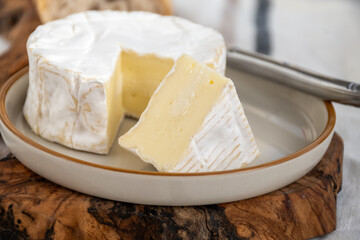 French soft Camembert cheese, original Camembert de Normandie made from raw cow milk