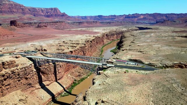 Drone shot of Navajo Bridge spanning the Colorado River in Arizona.