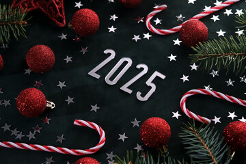 New Year 2025 dark background. Number of the coming year in Christmas decoration.