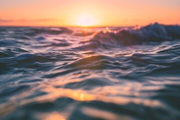 Obraz premium A serene ocean wave at sunset, capturing tranquil colors and gentle movement.