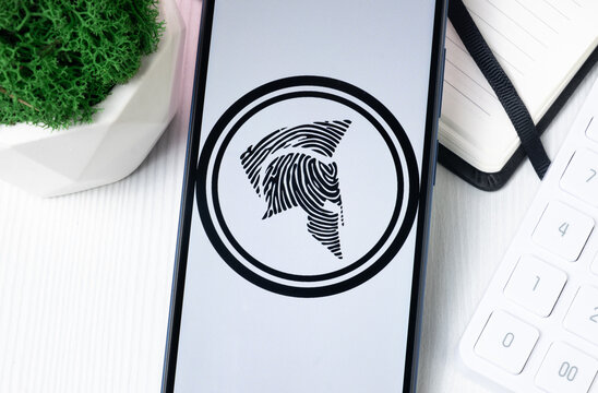 New York, USA - 1 August 2024: Aidos Kuneen ADK Logo on Phone Screen, Crypto Coin Icon