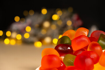 Christmas Gummy Colorful Candy on Garland Background.