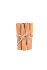 Several cassia spice sticks wrapped in string on white background.