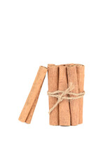 Several sticks of cassia spice on a white background.