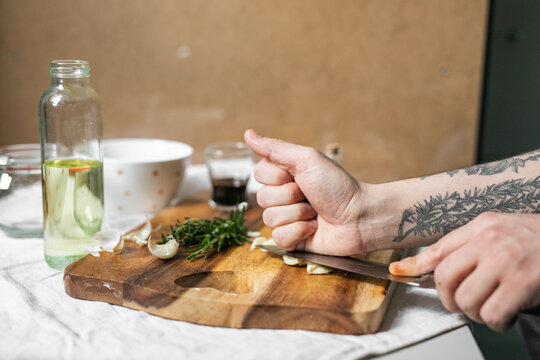 Crushing Garlic on Cutting Board