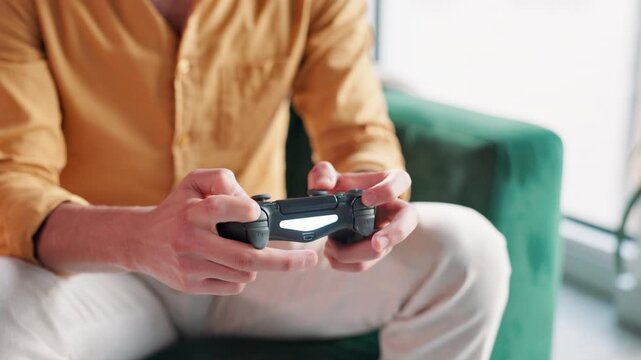 Hands, man and play game with controller for virtual gaming, esports challenge and streaming contest on web. Male person, relax and digital device for arcade competition, online video and house sofa