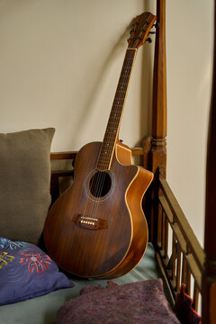 still life acoustic guitar on a wooden bed at a cottage in bali