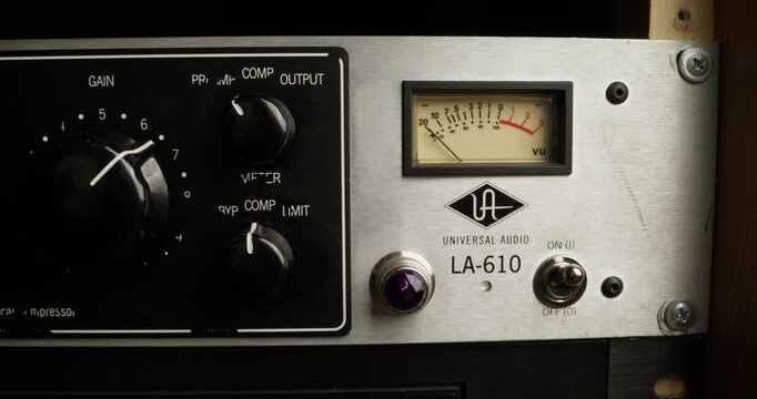 A man turns on a sound level meter, close-up of his hand, an unrecognizable person