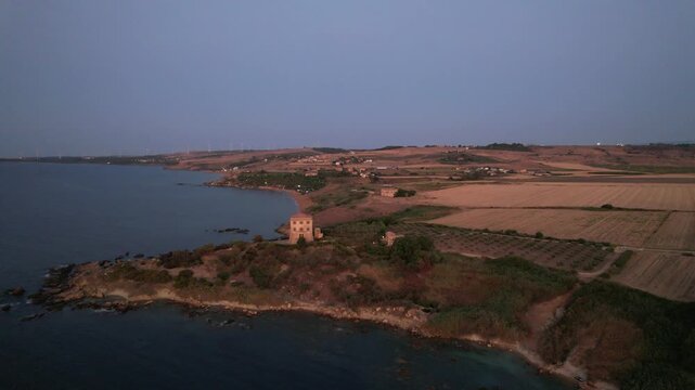 Archaeological area of ​​Capo Colonna. The last column of the Temple of Hera Lacinia remains erected. Italy Crotone 01.08.2024. drone video